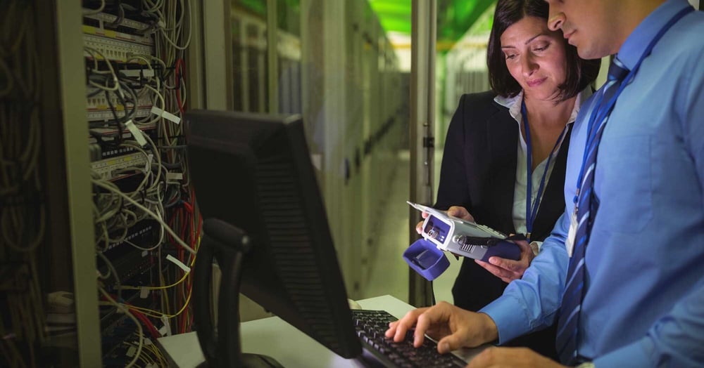 2 colleagues providing managed IT support to a Perth business