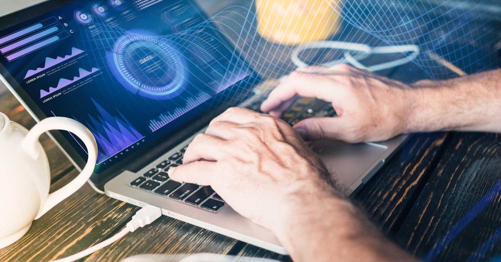 Man typing in his computer to arrange the managed IT support of his Perth business
