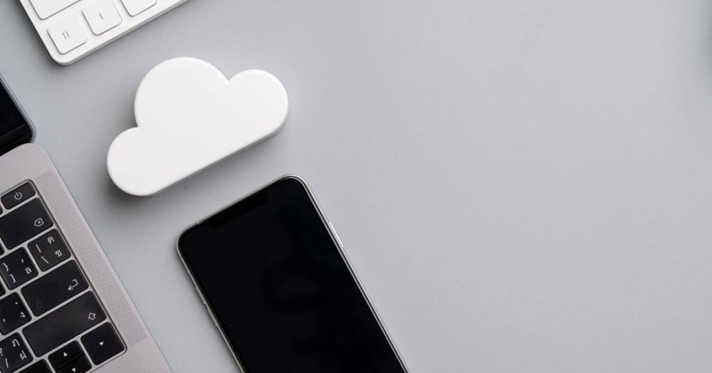 phone and computer with cloud storage icon