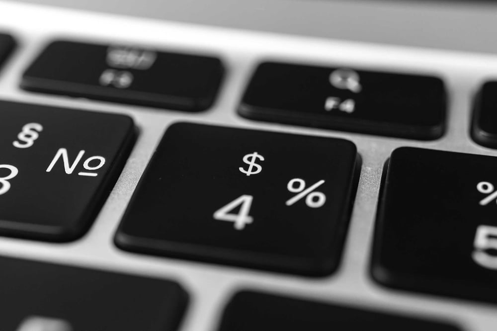 keyboard focusing on dollar sign to type in managed it services pricing