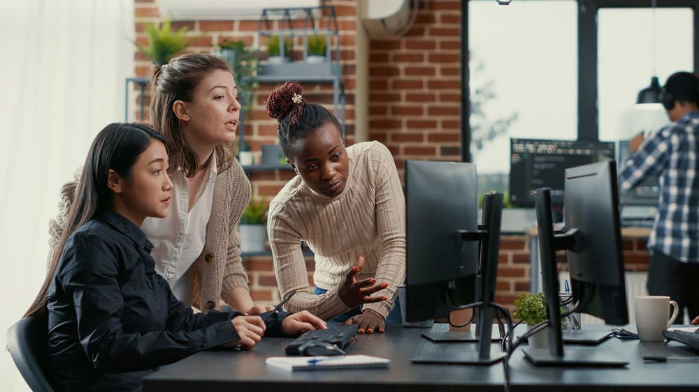 three tech experts providing managed IT services to a small to medium enterprise