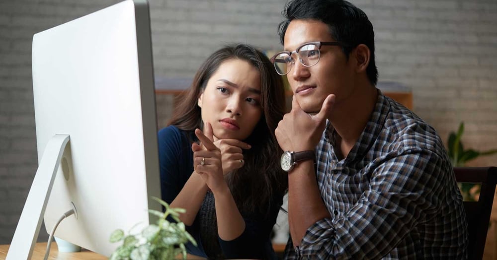 two people seeking managed IT support services in front of the computer