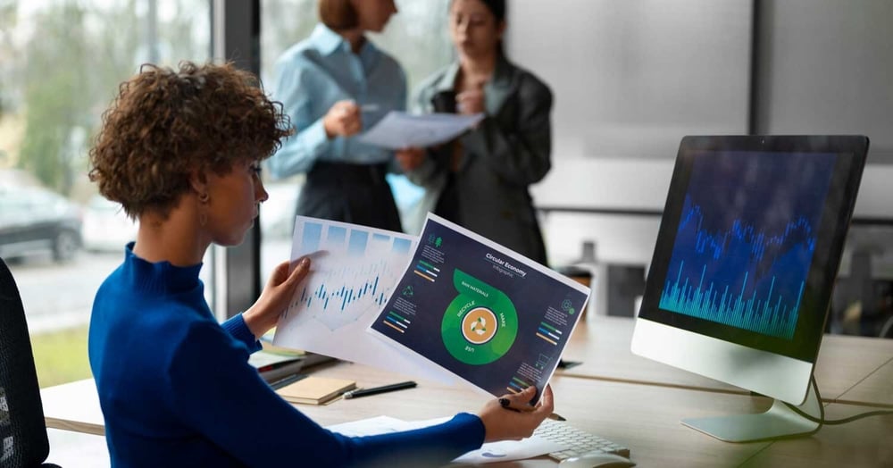 woman looking at figures and statistics about managed IT support