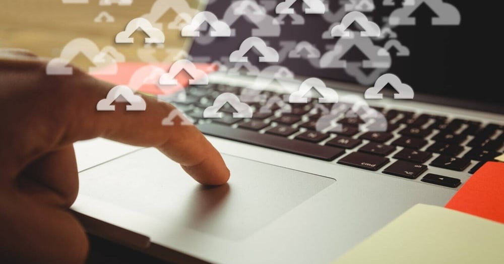 employee learning what is cloud storage using a laptop